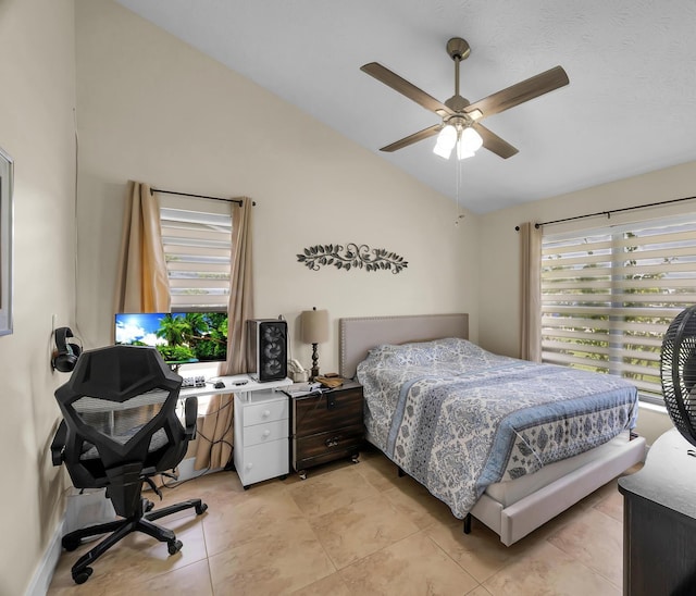 tiled bedroom featuring lofted ceiling and ceiling fan