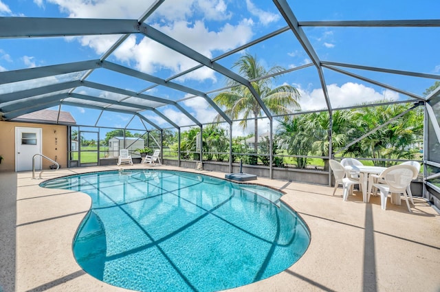 view of pool with a lanai and a patio area