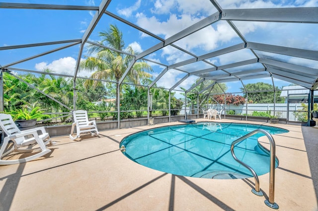 view of pool with a lanai and a patio area