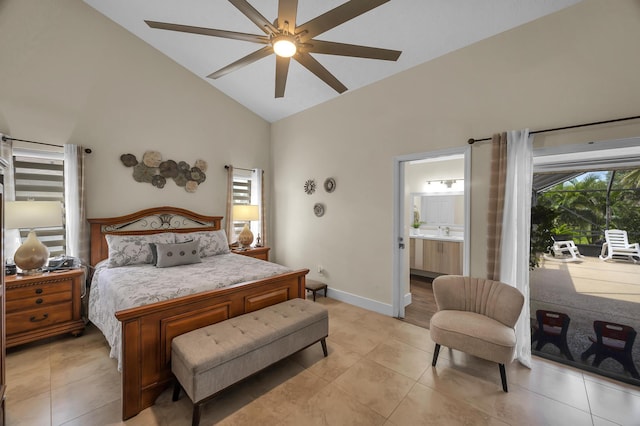 tiled bedroom featuring ceiling fan, ensuite bathroom, sink, and high vaulted ceiling