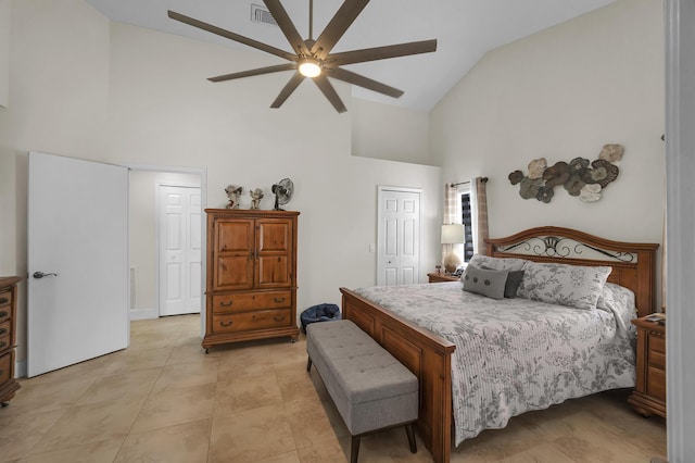 tiled bedroom featuring high vaulted ceiling and ceiling fan