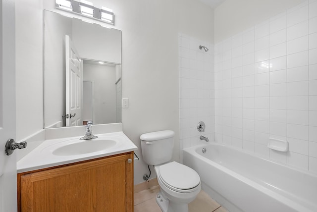 full bathroom with vanity, tile patterned flooring, tiled shower / bath, and toilet