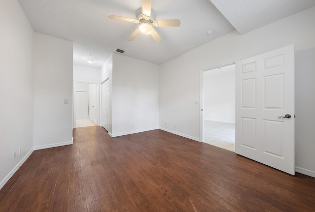 unfurnished room featuring a textured ceiling, ceiling fan, and hardwood / wood-style floors