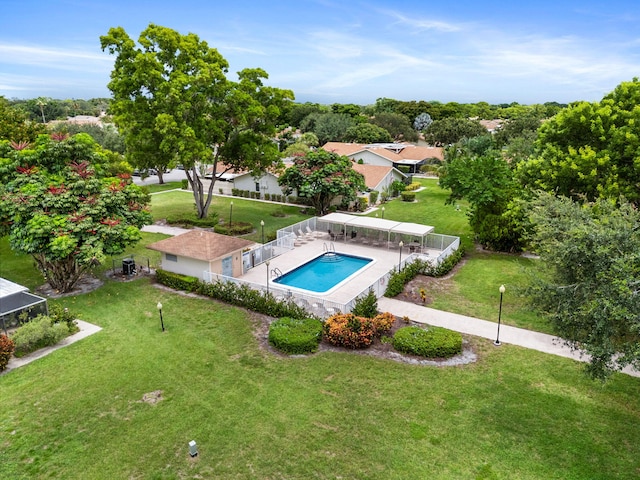 view of pool featuring a patio and a lawn