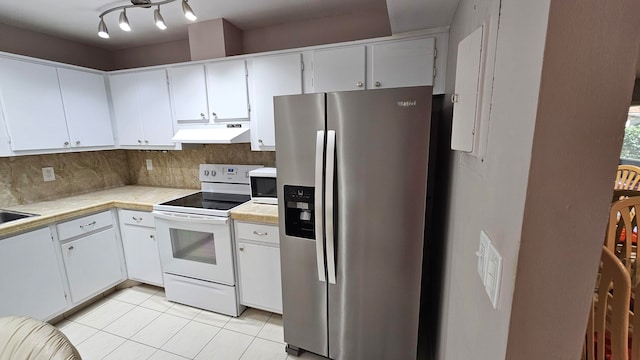 kitchen featuring decorative backsplash, white cabinets, stainless steel fridge with ice dispenser, white range with electric cooktop, and light tile patterned flooring