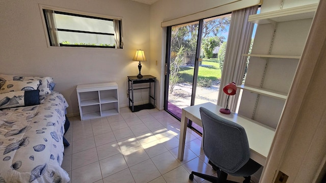 tiled bedroom featuring access to exterior