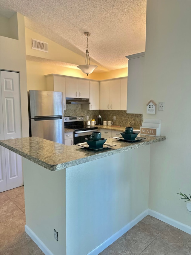 kitchen featuring pendant lighting, white cabinets, appliances with stainless steel finishes, lofted ceiling, and kitchen peninsula