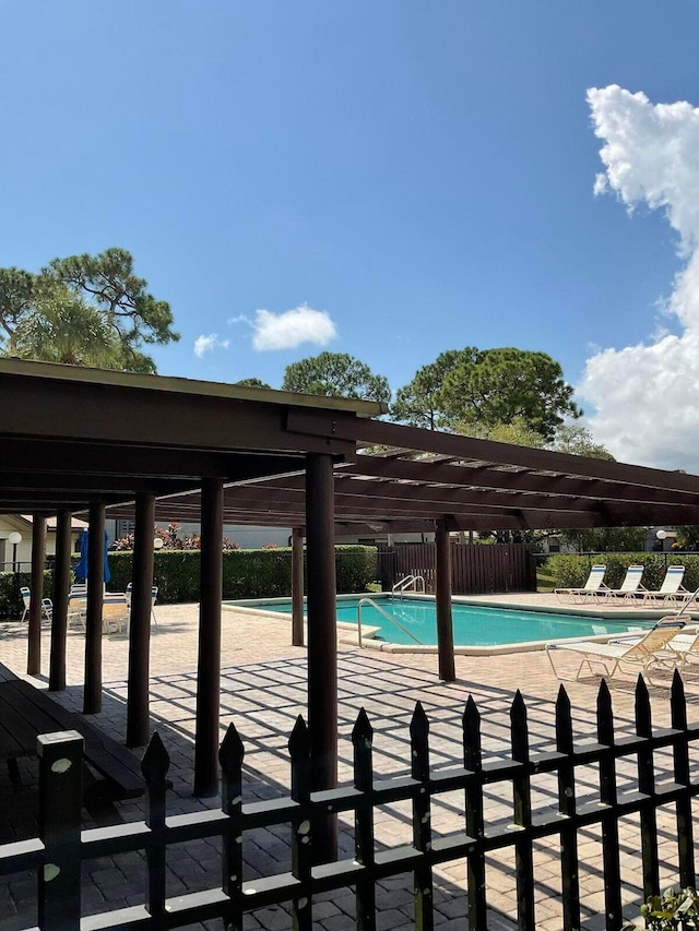 view of swimming pool featuring a patio area