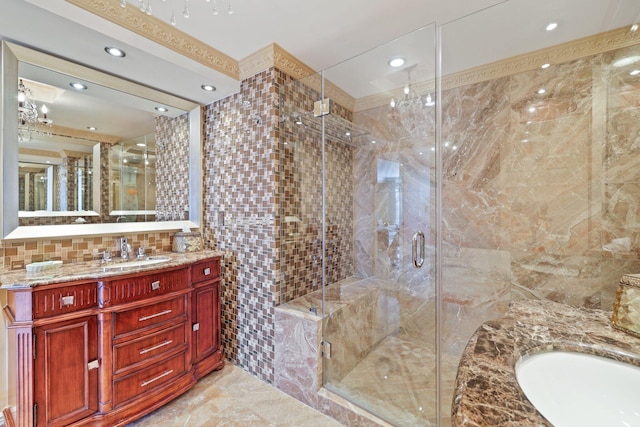 bathroom with vanity, tile patterned floors, backsplash, and tile walls