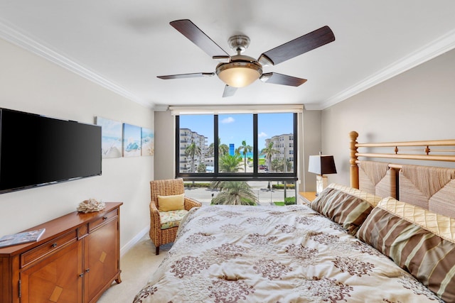 bedroom with crown molding, light carpet, ceiling fan, and a wall of windows