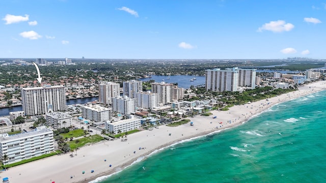 bird's eye view with a beach view and a water view