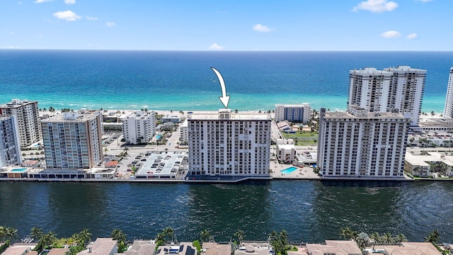 birds eye view of property with a water view