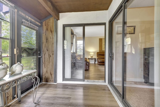 sunroom with beam ceiling and wood ceiling