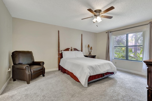 bedroom with light carpet, a textured ceiling, and ceiling fan