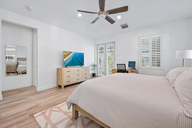 bedroom with access to exterior, light hardwood / wood-style flooring, and ceiling fan