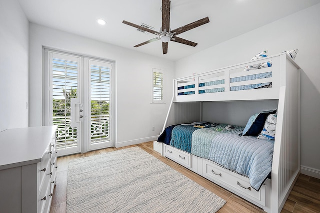 bedroom featuring access to outside, ceiling fan, and light hardwood / wood-style flooring