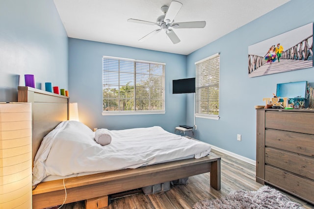 bedroom featuring ceiling fan and wood-type flooring