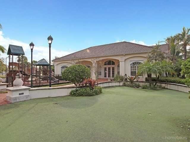 exterior space featuring a playground and a lawn