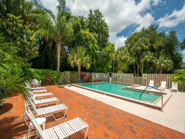 view of swimming pool with a patio