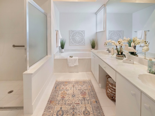 bathroom featuring tile patterned flooring, vanity, and independent shower and bath