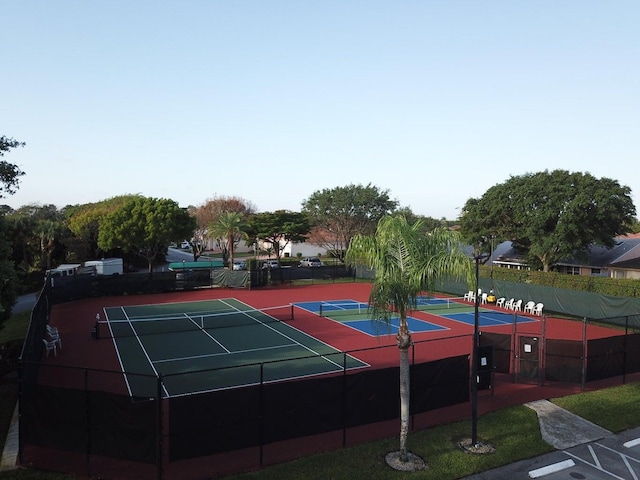 view of sport court featuring fence