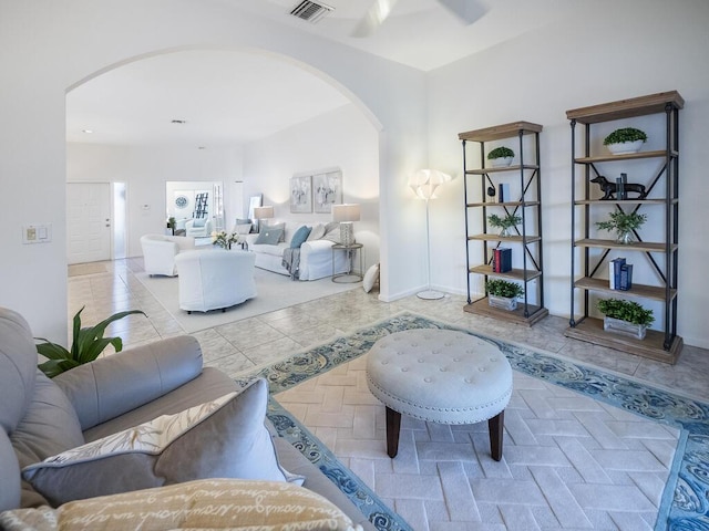 living room with ceiling fan and light tile patterned floors