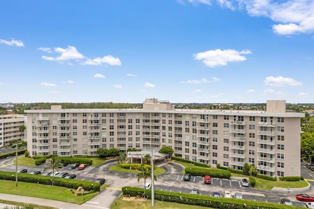 view of property with uncovered parking