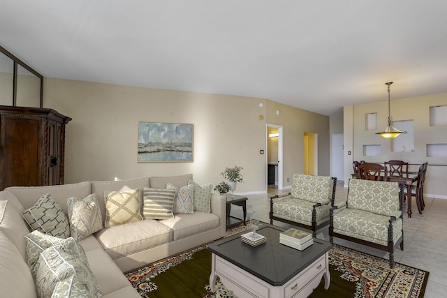 living room featuring light tile patterned floors and baseboards