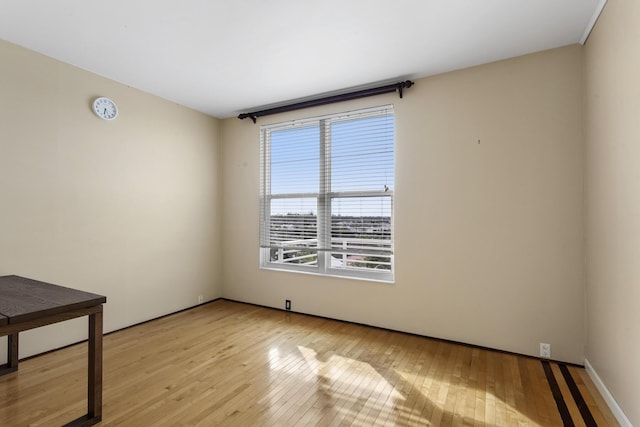 spare room with light wood-style floors