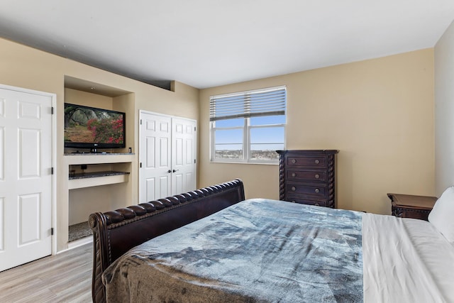 bedroom with wood finished floors