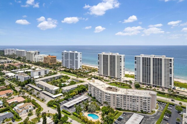 birds eye view of property featuring a water view and a view of the beach