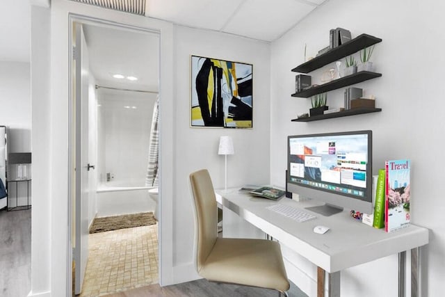 home office featuring a drop ceiling