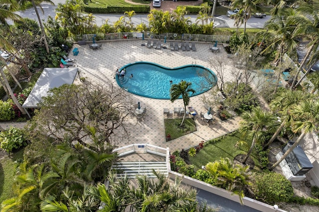 pool featuring a patio area and fence