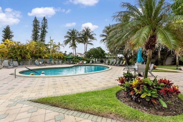 pool featuring a patio area and fence