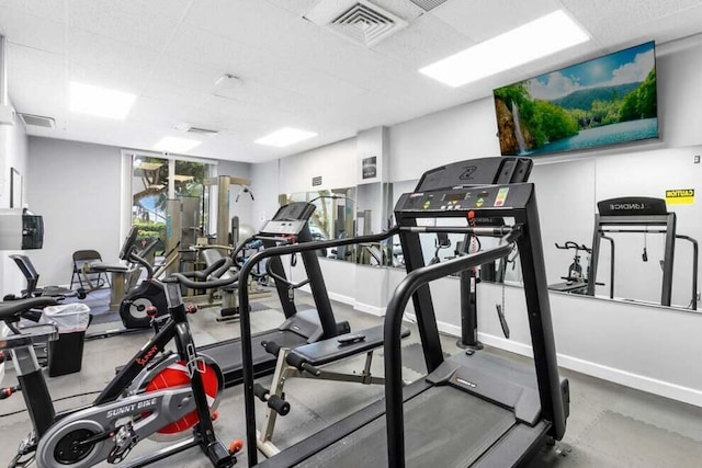 workout area featuring baseboards and visible vents