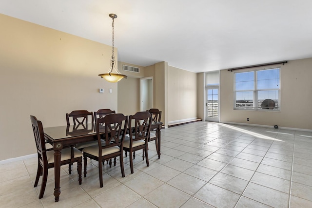 dining room with light tile patterned floors, baseboards, and visible vents