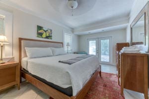 bedroom with french doors and ceiling fan