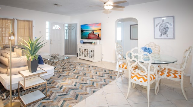 tiled dining room featuring ceiling fan