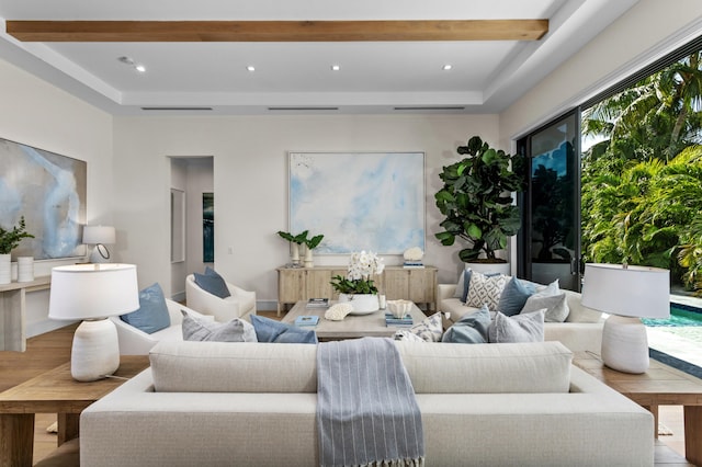 living room with beamed ceiling and light hardwood / wood-style flooring