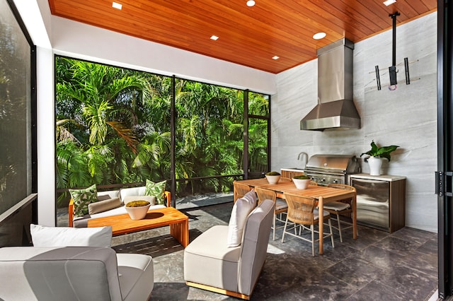 sunroom featuring wooden ceiling