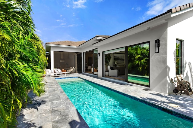 view of pool featuring a patio