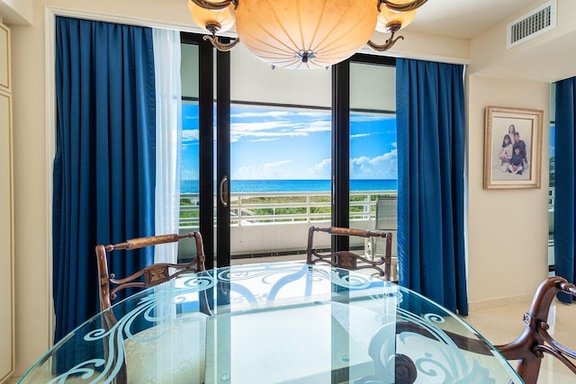 dining area featuring a water view