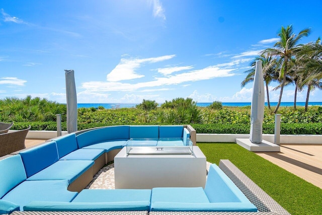 view of swimming pool with an outdoor living space, a water view, and a patio area