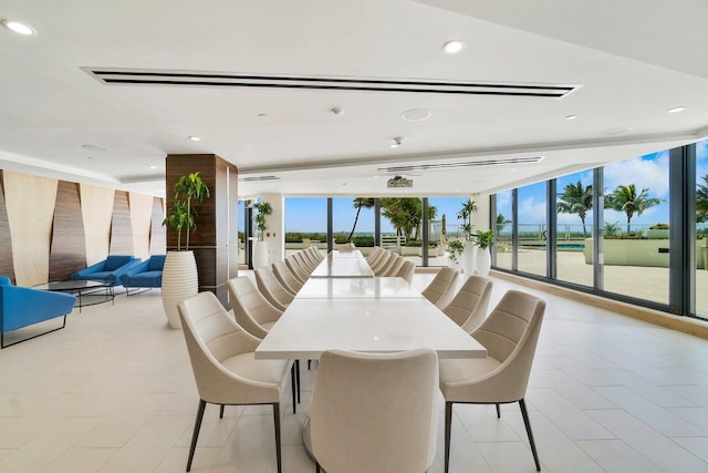 tiled dining space with floor to ceiling windows