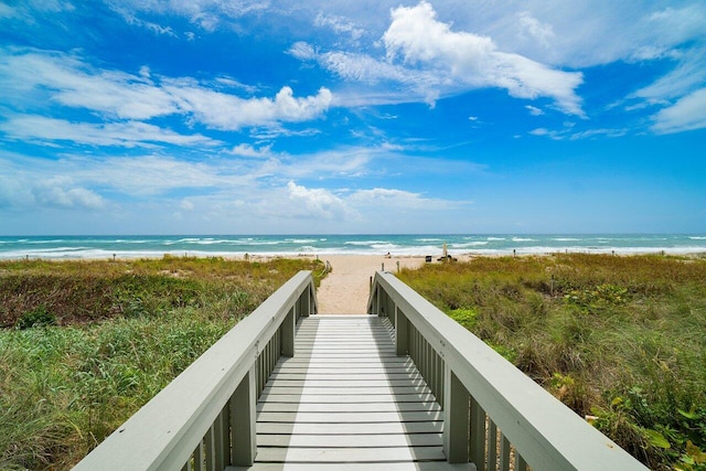 view of community featuring a view of the beach and a water view