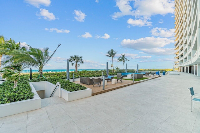 view of patio / terrace featuring an outdoor living space and a water view