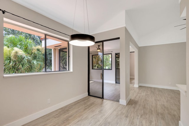 interior space featuring light hardwood / wood-style flooring, ceiling fan, and plenty of natural light