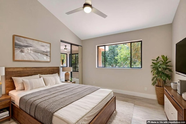 bedroom featuring light wood-type flooring, vaulted ceiling, baseboards, and ceiling fan