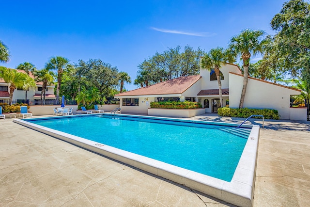 view of swimming pool featuring a patio