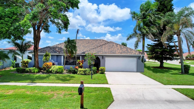 view of front of property with a front lawn and a garage